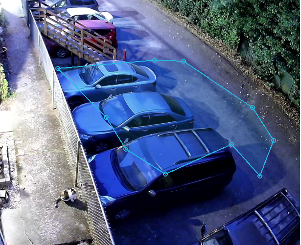 A compact polygon focus area drawn around parked vehicles
